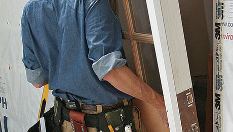 general handyman services includes a guy installing a new door