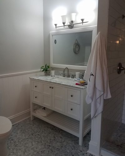 Bathroom renovations with new floor and painted vanity